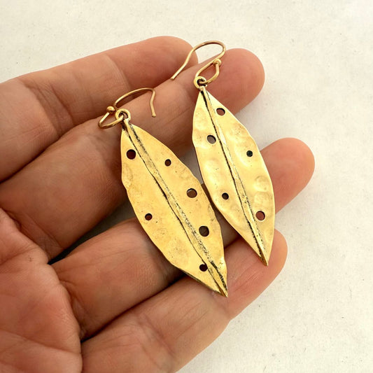 Pohutukawa leaf earrings close-up showing hammered texture