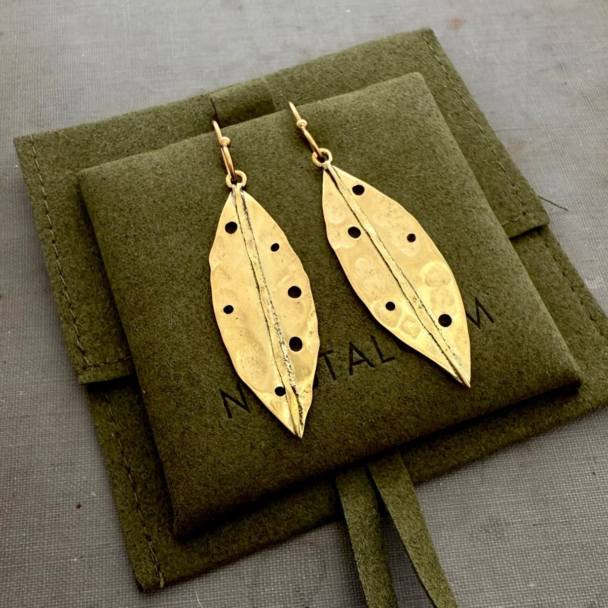 Pohutukawa leaf earrings styled shot