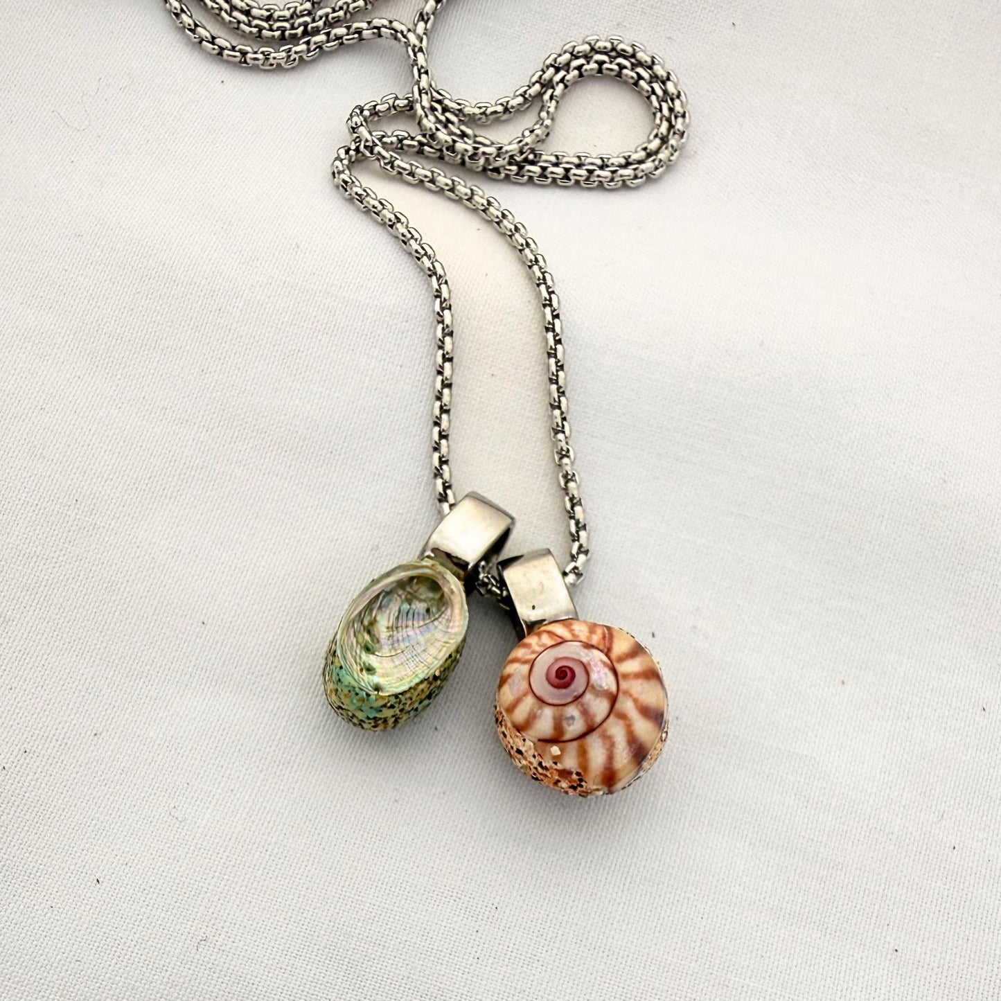 Pāua & Koru Wheel Shell Pair Necklace