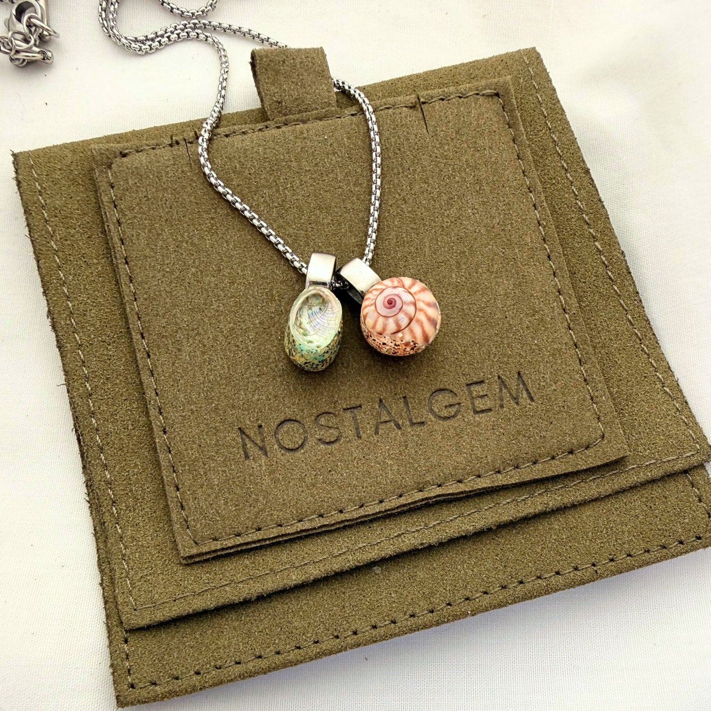 Pāua & Koru Wheel Shell Pair Necklace