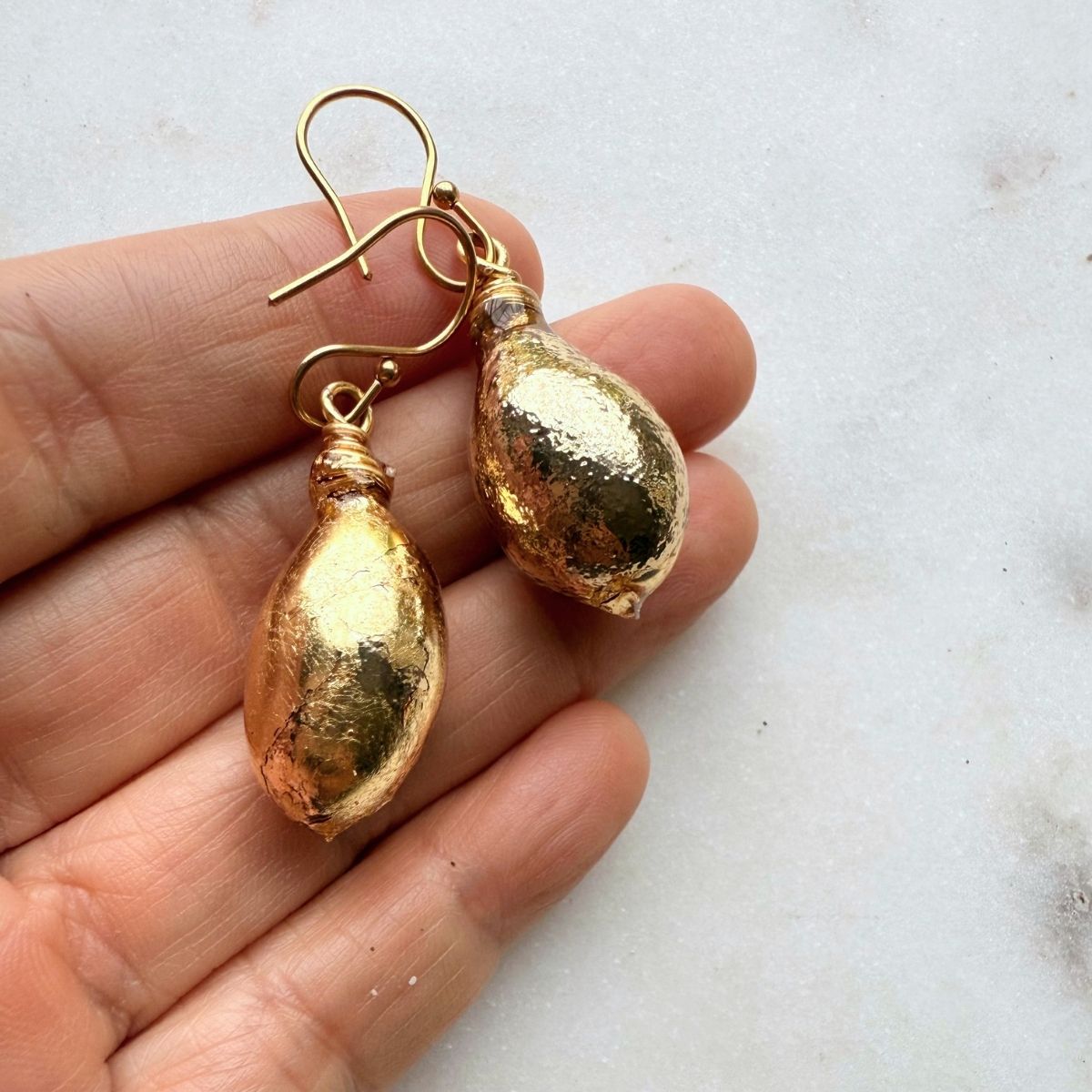 Seaweed bladder earrings worn on model