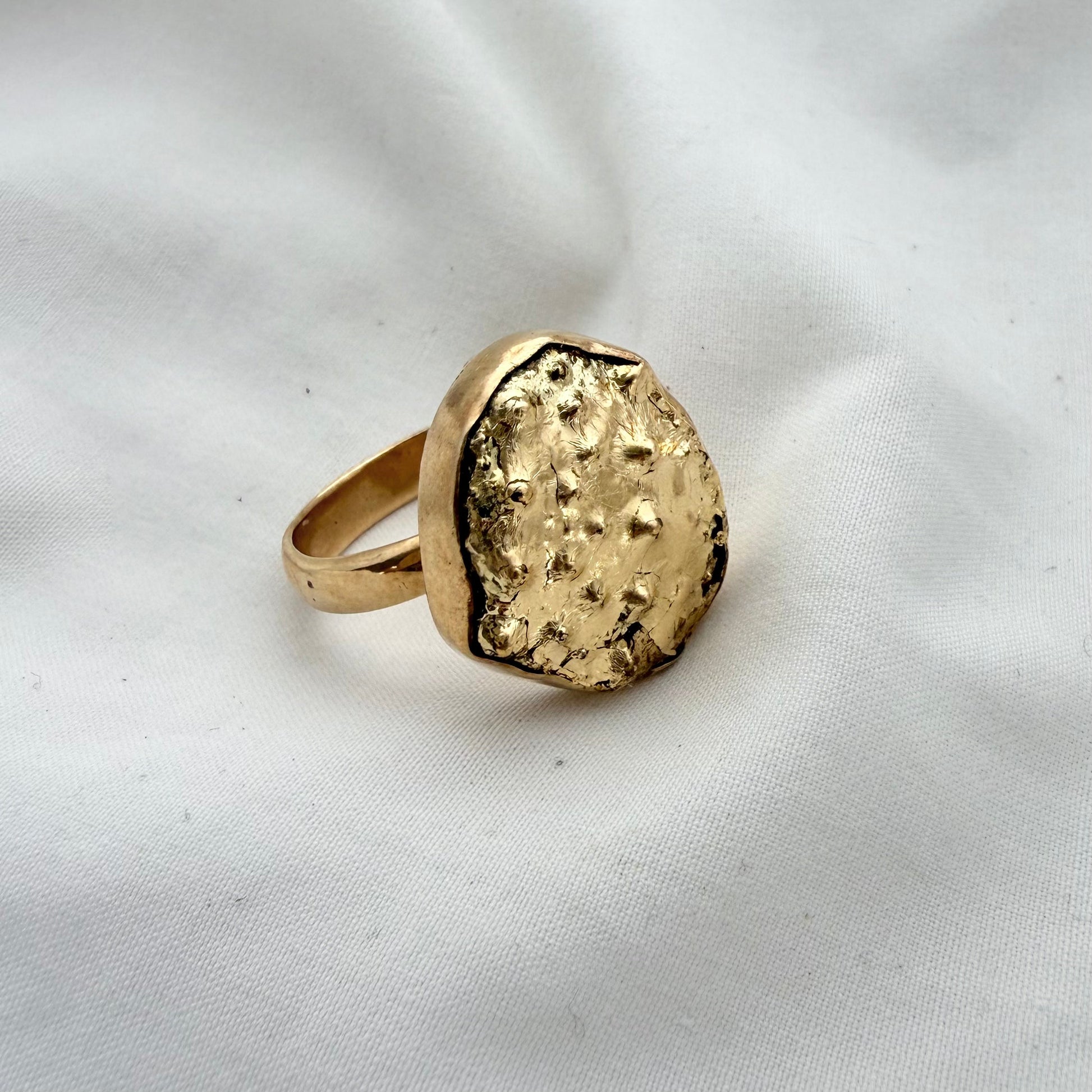 Broken kina shell fragment ring, gold-leafed, handmade New Zealand jewellery