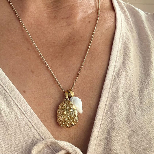 Broken kina and whelk shell necklace close-up detail