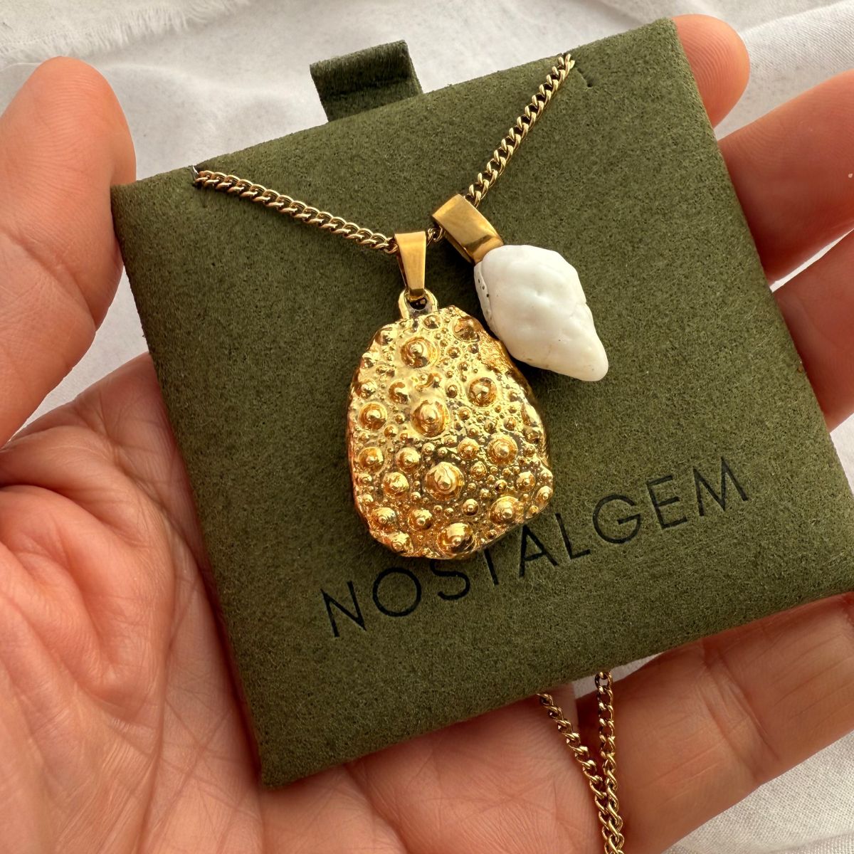 Broken kina and whelk shell necklace styled shot