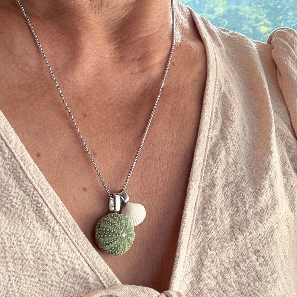 Mother and child kina cockle necklace worn on model