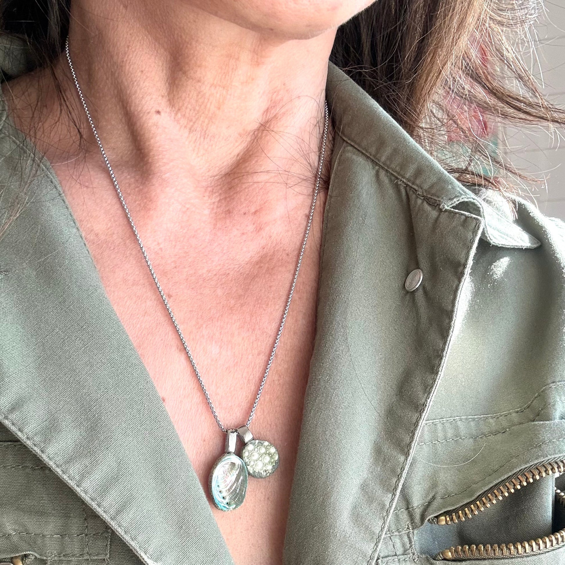 Broken kina shell pendant detail on necklace