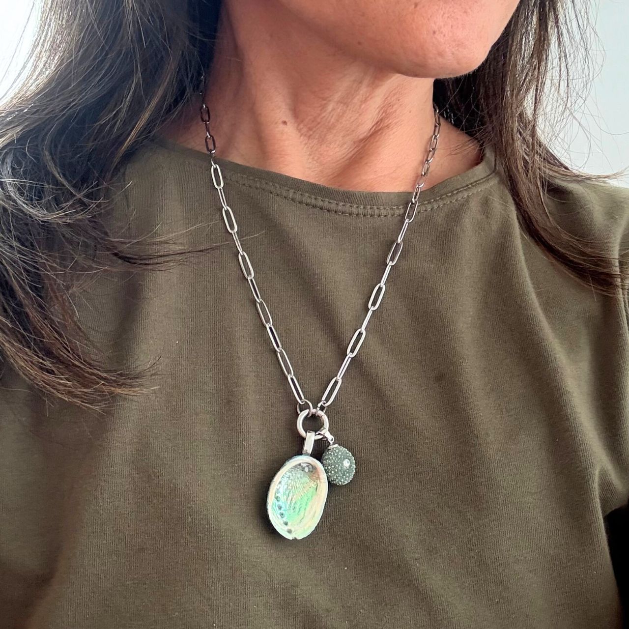 Paua and kina shell charm holder necklace close-up detail