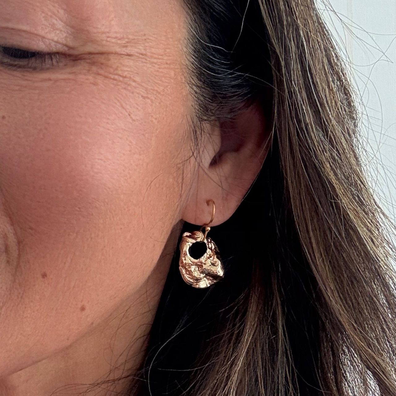 Broken oyster shell earrings styled shot