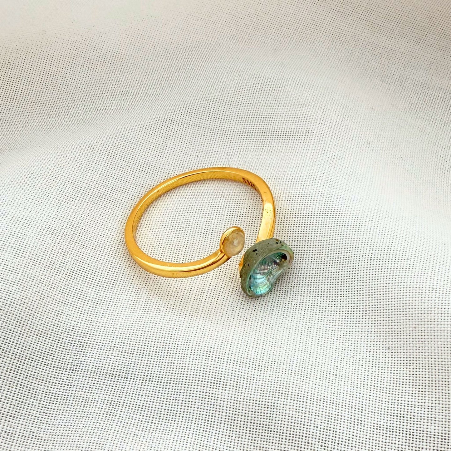Paua and sand dome ring cuff worn on hand