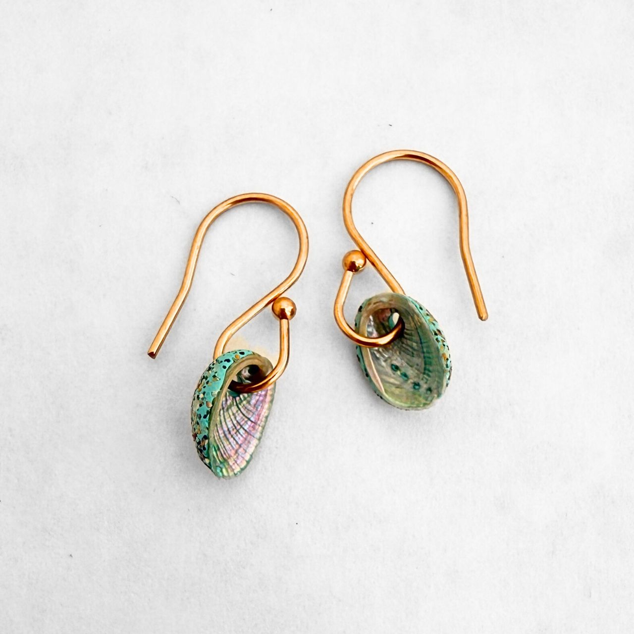 Tiny farm paua shell hook earrings, beachsand stone setting, handmade New Zealand jewellery