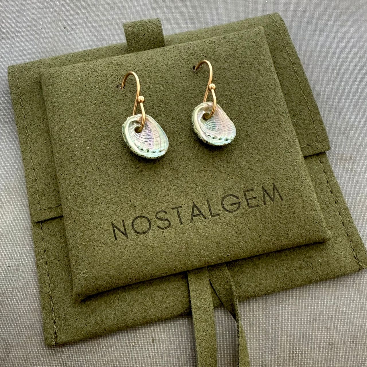 Paua shell beachsand stone hook earrings styled shot