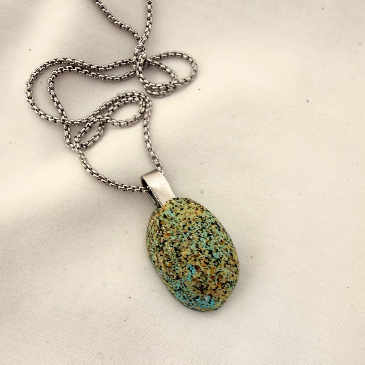 Paua shell pendant necklace styled on model