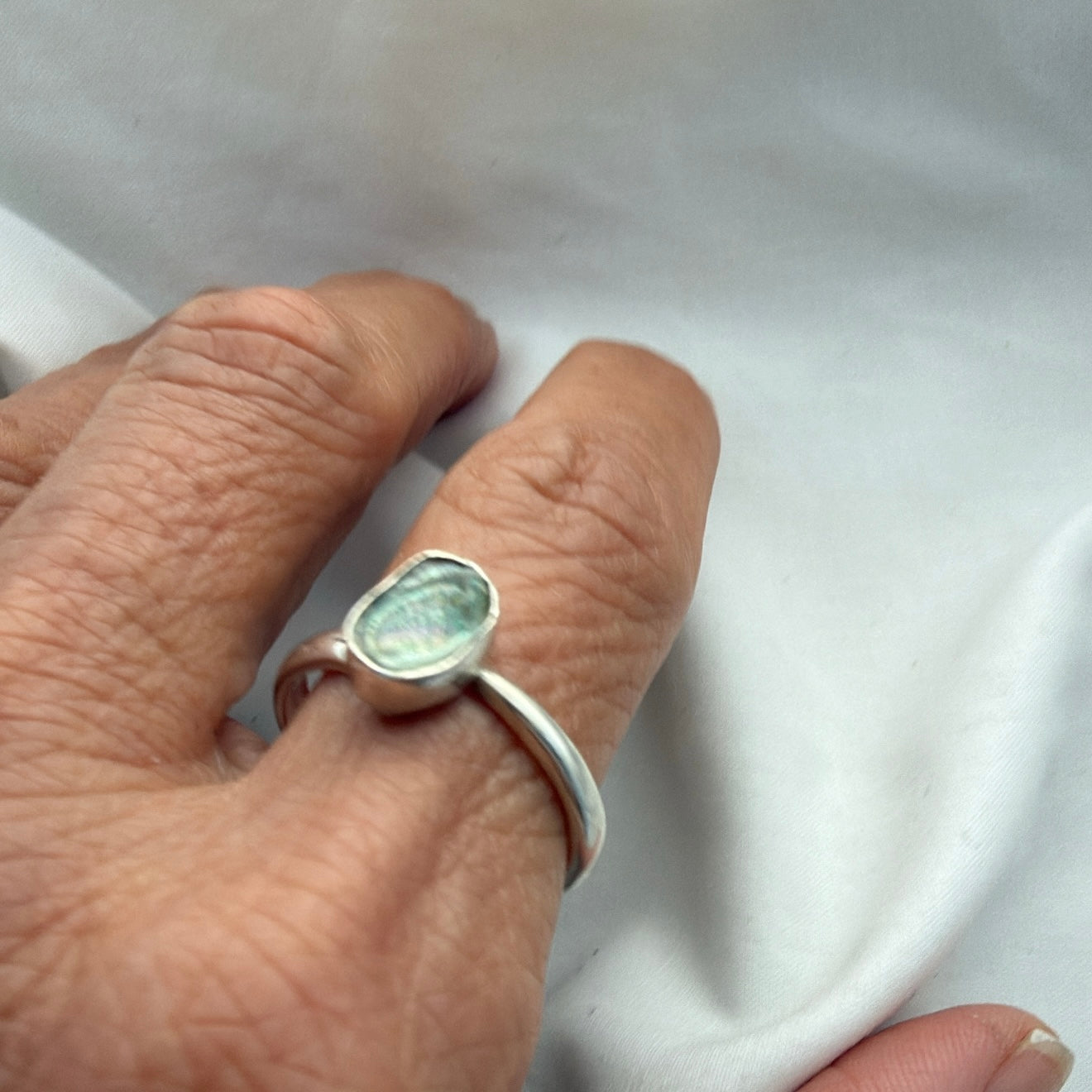 Paua shell sterling silver ring close-up detail
