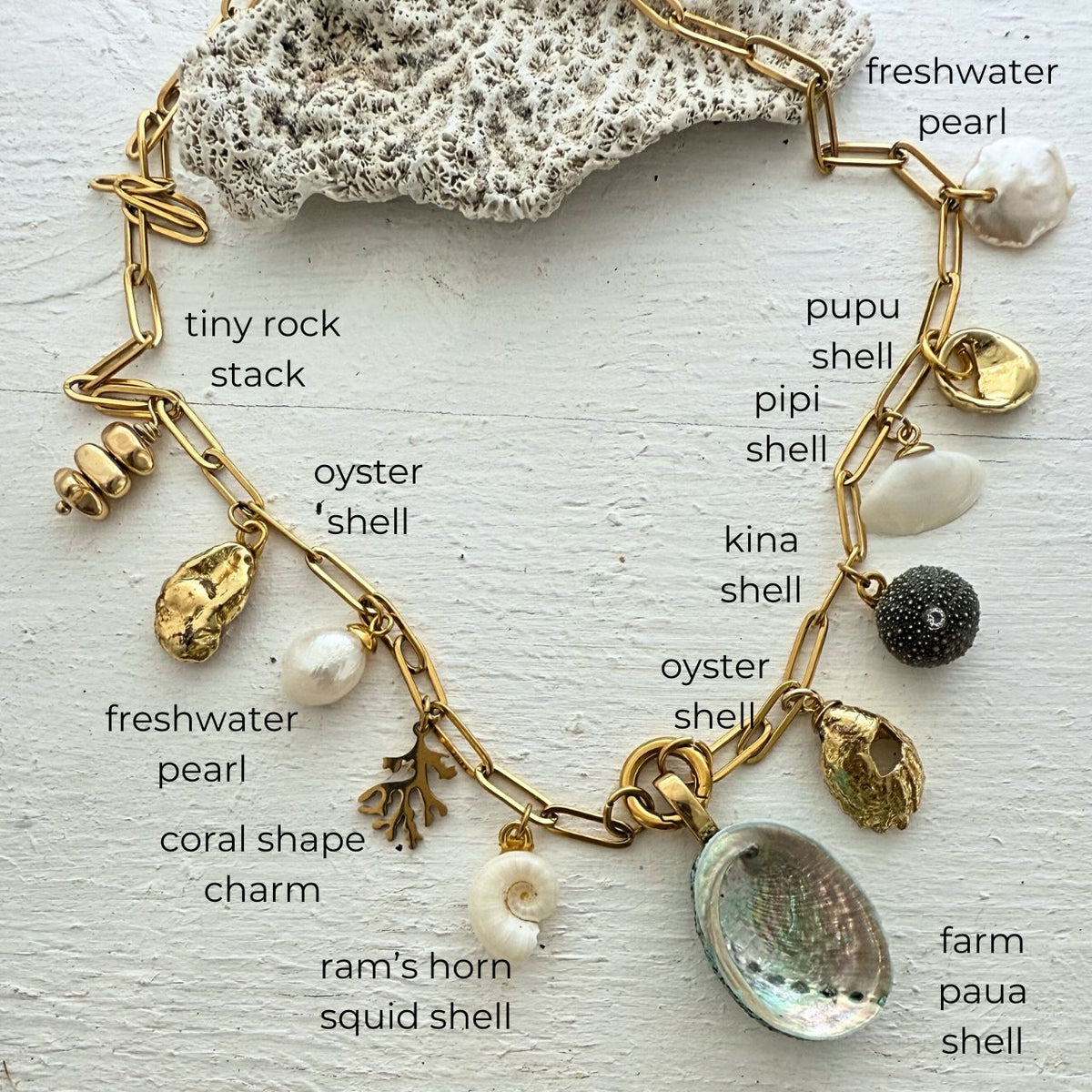Statement charm necklace close-up showing shell charms