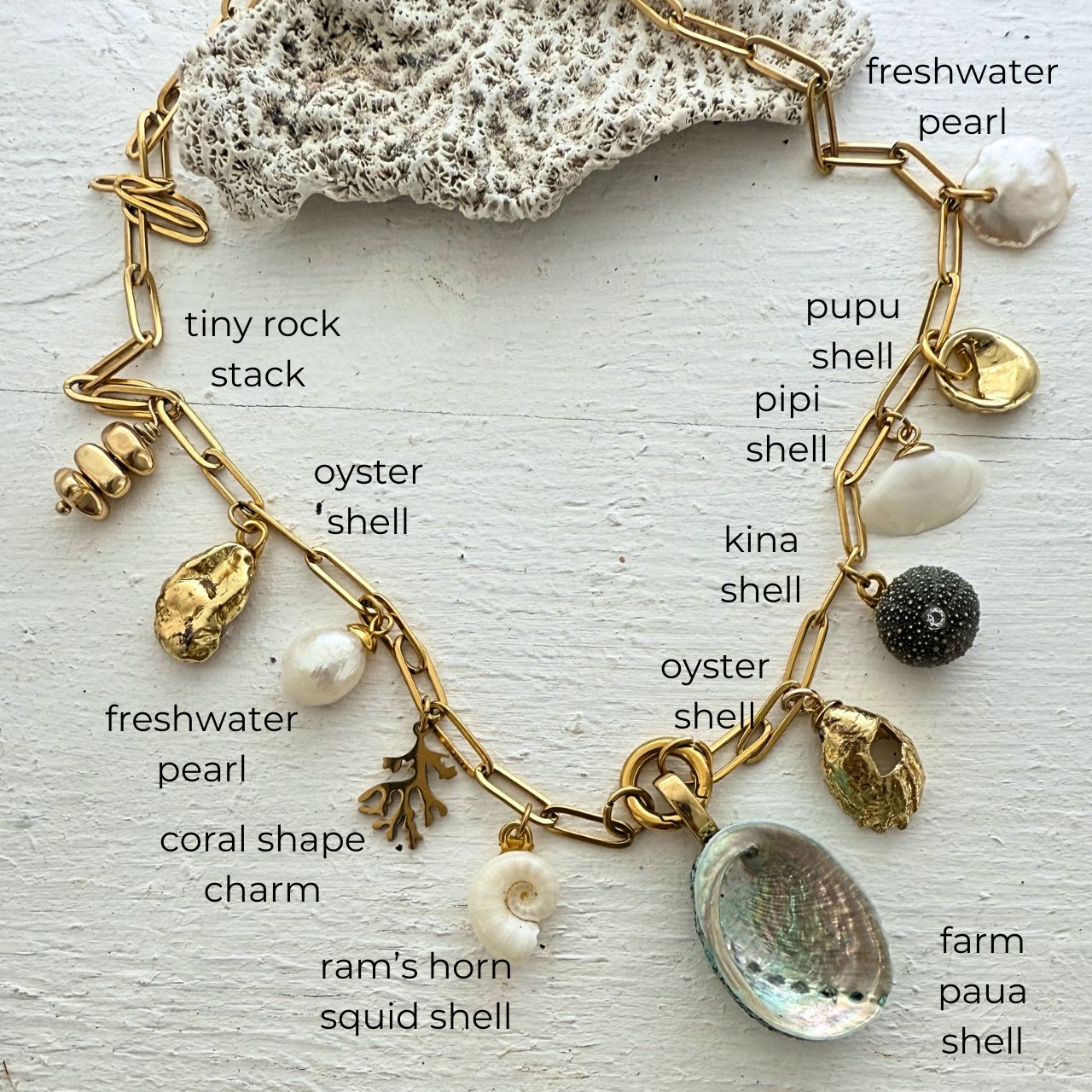 Statement charm necklace close-up showing shell charms