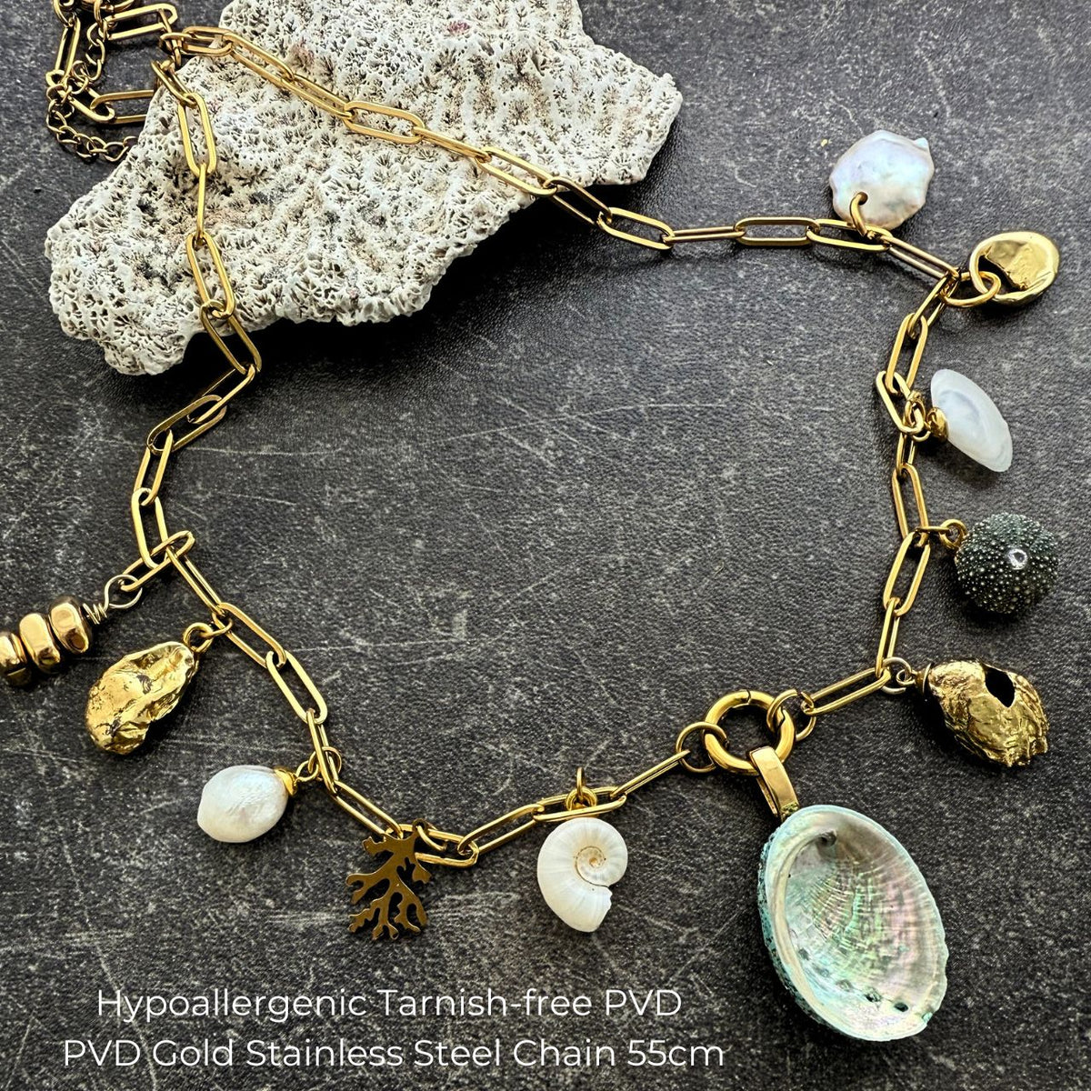 Statement charm necklace worn on model