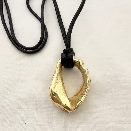 Worn out whelk shell cord necklace goldplated, handmade jewellery